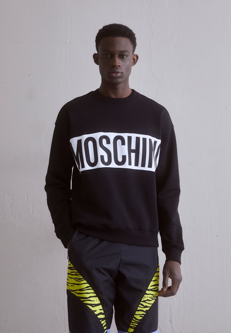 Moschino Felpa con simbolo MWF03E