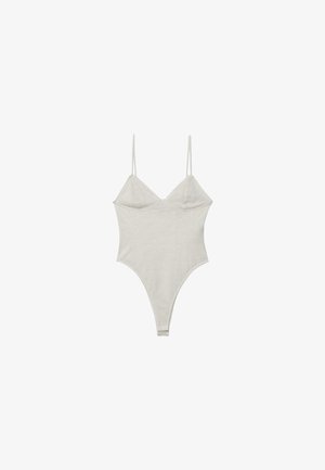 Body blanc une pièce avec fines bretelles et encolure en V, fabriqué en tissu doux et extensible.