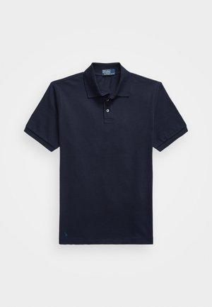 Polo din material texturat de culoare bleumarin, având o închidere cu două nasturi și un mic logo brodat la tiv. Mâneci scurte.