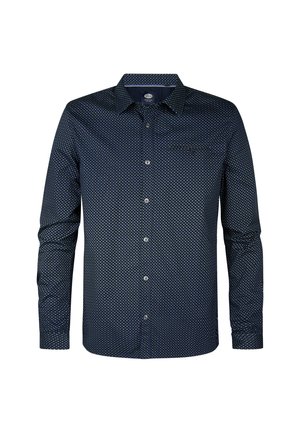 Námořnická modrá košile s dlouhým rukávem, bílými puntíky, s límcem na knoflíky, jednou náprsní kapsou a knoflíkovým zapínáním vpředu.