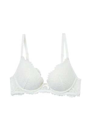 Reggiseno bianco in pizzo con motivo floreale, coppe imbottite, spalline regolabili e dettaglio a fiocco al centro. Tessuto liscio e bordi scallop.
