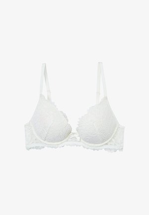 White lace bra with floral pattern, padded cups, adjustable straps, and a bow detail at the center. Smooth texture and scalloped edges.