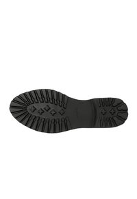 Zwarte rubberen schoenzool met opvallende groeven, gebogen vorm en kruispatroon voor verbeterde grip. Stempellogo zichtbaar.