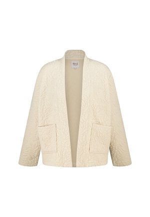 Gequilte crèmekleurige kleding met een ontspannen pasvorm, voorzien van een V-hals, open voorkant en twee zijzakken. Geweven patroon overal.