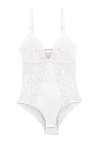 Bodysuit en dentelle blanche avec des panneaux en satin doux, des bretelles ajustables, des bords festonnés et des motifs floraux complexes. Présente un décolleté en U.