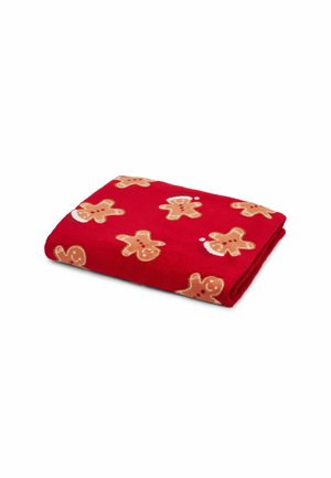 Coperta in pile rossa con un motivo ripetuto di omino di pan di zenzero in beige con accenti rossi. Tessuto morbido con design piegato.