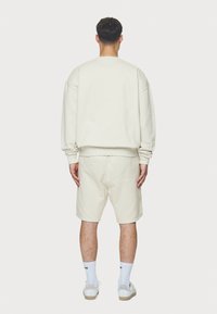 Pegador LOGO OVERSIZED SWEATER - Sweatshirt - washed salty cream