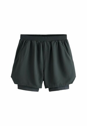Șorturi atletice de culoare verde închis, confecționate dintr-un material neted și ușor. Prezintă un elastic strâns la talie și două buzunare laterale. Strat interior mai scurt.