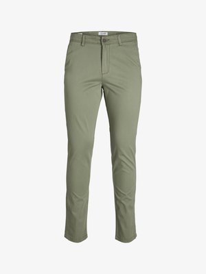 Lichtgroene slim-fit chinos gemaakt van een soepele stof met een knoopsluiting en riemlussen. Heeft een platte voorkant en taps toelopende benen.
