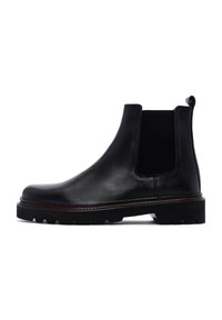 Zwarte leren Chelsea-boots met elastische zijpanelen, ronde neus en gestructureerde rubberen zool. Subtiele stiksels langs de rand.