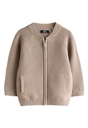 Vaaleanbeige ribbineulottu vetoketjullinen neuletakki, jossa kaksi etutaskua ja ribbineulotut hihansuut, pääntie ja helma, suunniteltu lapsille.