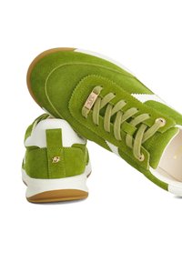 Green suede sneakers with white accents, featuring lace-up design, gold logo detail, and rubber sole for grip. Back tab for easy wear.