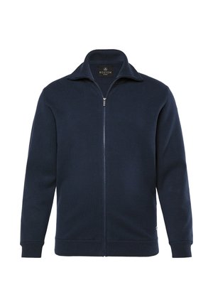 Granatowa bluza zapinana na zamek, wykonana z dzianiny, z podniesionym kołnierzem oraz ściągaczami przy mankietach i u dołu, z metką z logo na dolnym boku.