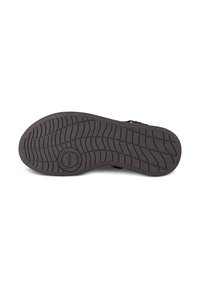 Čierna gumová podrážka tenisky s textúrovaným vzorom tread. Má kruhové logo so značkou "Wooden" v strede podrážky.
