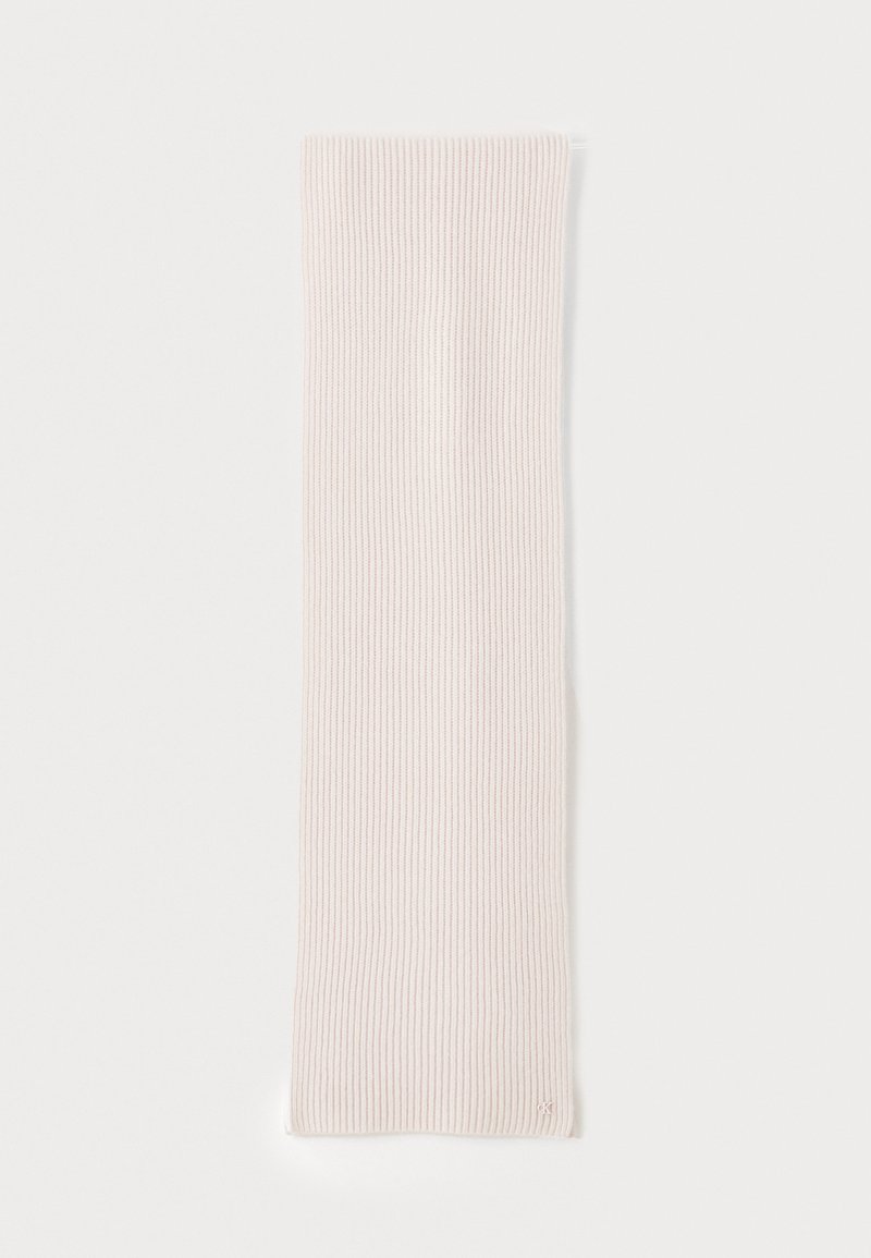Light pink ribbed fashion scarf made of soft fabric. Long and narrow shape, featuring subtle texture and a small logo accent.