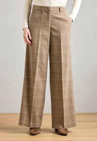 Bruine geruite wijde pijpenbroek van een geweven stof, met een hoge taille, zijzakken en een ontspannen pasvorm.