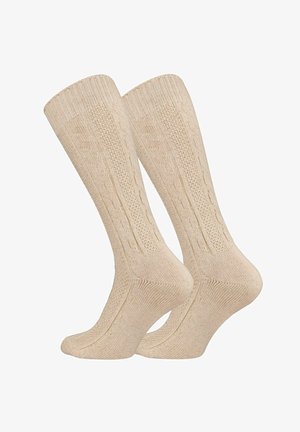 Beige gestrickte Socken mit einem gerippten Schaft, ausgestattet mit einem strukturierten vertikalen Muster. Weicher Stoff, Knöchelhöhe, geeignet für den Alltag.