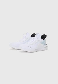 White athletic shoes with a textured mesh upper, black heel accents, and a light blue overlay. Features lace-up closure and low-profile design.