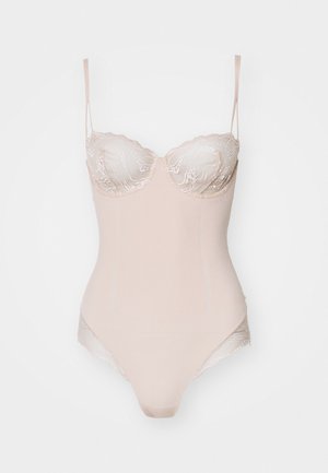 Bodysuit beige con encaje en los copas, tirantes ajustables, tejido liso y una silueta ajustada. Presenta un diseño inferior sin costuras.