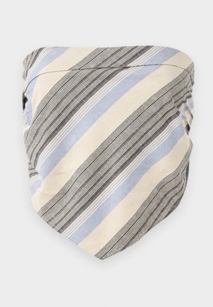 Tuba rayé en beige, bleu et noir. Présente des lignes diagonales de différentes largeurs. Fabriquée en tissu léger avec une texture lisse.
