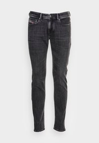 Svarta slim-fit jeans i denim med en standard femficksdesign, knappstängning och subtil blekning för extra textur.