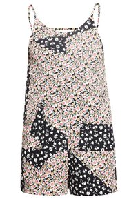 Jumper de estampado floral con tirantes finos, que presenta una mezcla de patrones florales claros y oscuros sobre un fondo negro, confeccionado en una tela ligera.