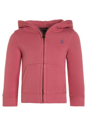 Cotton zip-up hoodie in pink, featuring a front pocket, ribbed cuffs, and a small blue logo on the chest. Soft texture, casual design.