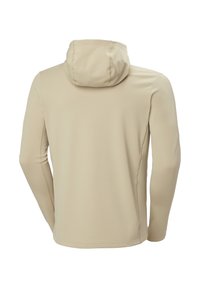Beige lange mouwen capuchonjack gezien van achteren met zichtbare naaddetails en een getailleerde pasvorm.