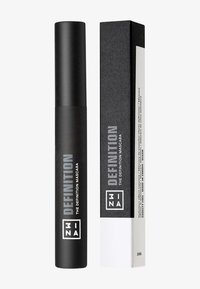 Tubetto di mascara nero con finitura opaca, etichettato "DEFINITION" in bianco. Accompagnato da una scatola rettangolare, nera con accenti bianchi.