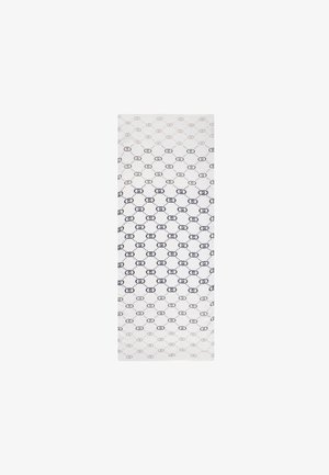 Tessuto rettangolare con base bianca, caratterizzato da un motivo ripetuto di forme ovali blu scuro e contorni punteggiati sparsi.