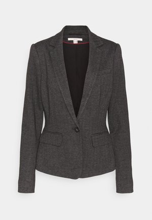 Blazer pour femme gris foncé à motif chevrons, fermeture à un bouton, revers crantés et poches à rabat à l'avant.
