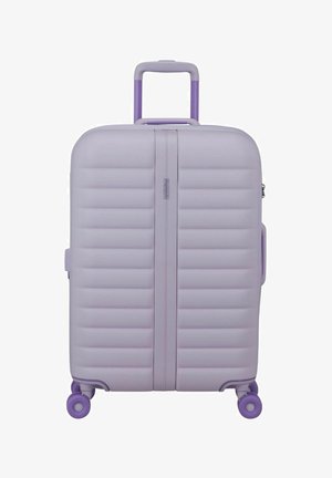 Mauve hard-shell suitcase with horizontal ridges, purple telescopic handle, side handles, and four purple spinner wheels.
