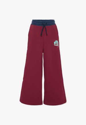 Bordeaux bredere broek met een marineblauwe elastische tailleband en trekkoord, met een klein "MSGM" logo in teal en wit op de linker bovenbeen.