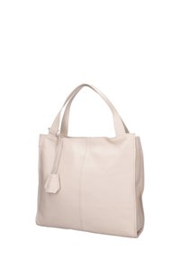 Sac fourre-tout en cuir beige clair avec deux poignées effilées, une texture lisse, une couture centrale et un petit accent géométrique.