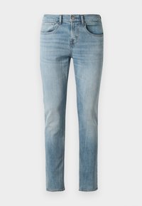 Jasnoniebieskie dżinsy wykonane z bawełny, w slim fit, z pięcioma kieszeniami, lekko przetarcia z delikatnymi whiskerami na udach.
