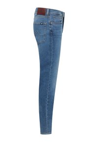 Fitted blue jeans in denim fabric, featuring a mid-rise waist, minimal back pocket detailing, and a stitched hemline.