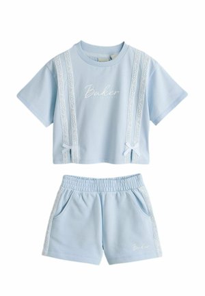 Light blue two-piece set with short-sleeve crop top and elastic waist shorts, featuring white lace stripes and "Baker" logo text.