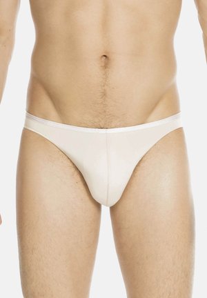 Weiße Baumwollslips mit klassischem Schnitt, einem glatten, elastischen Bund und minimalistischem Design, das eine taillierte Silhouette betont.