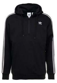 Svart huvtröja med kvartszipp, med vita sidostrippar och ett broderat logo på bröstet. Mjukt material och ribbade muddar.