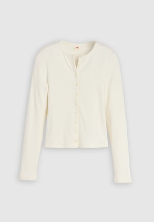 Top alb cu mâneci lungi, cu dungi, decolteu rotund și o rândure de nasturi în față. Design cropped, textură moale.