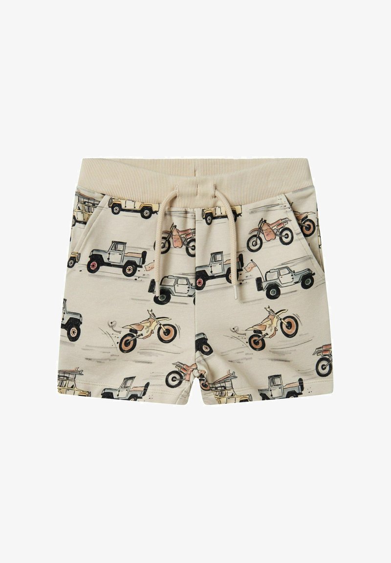 Beżowe szorty z powtarzającym się wzorem pojazdów i motocykli. Elastyczny pasek z możliwością regulacji oraz boczne kieszenie. Miękka tekstura materiału.