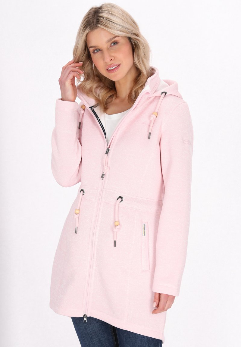 Light pink hooded jacket with a zip front, drawstrings, and wooden accents. Features long sleeves and two front pockets. Soft, textured fabric.