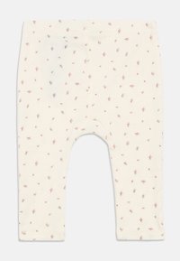 Κρέμα χρωματισμένα κολάν μωρού με μικρή ροζ λουλουδάτη εκτύπωση, ελαστική μέση και σχέδιο ευθείας γραμμής, τοποθετημένα επίπεδα.