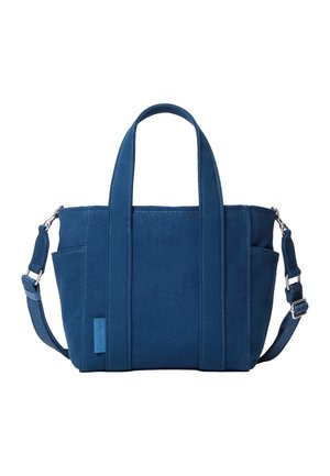 Geantă tote din pânză albastră cu două mânere superioare, buzunare laterale, curea de umăr detașabilă și o mică etichetă cu logo-ul Calvin Klein pe față.