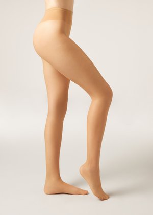 Nude, tætsiddende strømpebukser med en glat overflade, høj talje og en tætsiddende pasform, der dækker fra talje til fod, med en sømløs finish.