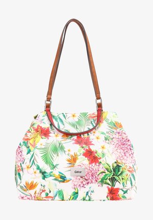 Sac à main porté épaule avec des bretelles marron et un motif tropical coloré de fleurs et d'oiseaux sur fond blanc, étiquette métallique rectangulaire de la marque à l'avant.