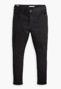 Jean noir slim avec poches avant, fermeture à boutons, passants de ceinture et coutures sur un fond blanc.