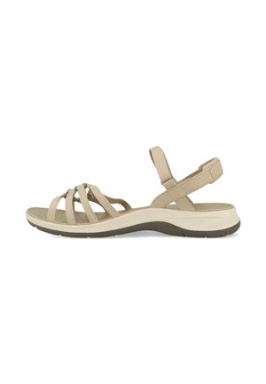 Beige sandal featuring crisscross straps, adjustable back strap, and a textured sole. Made from synthetic materials with a cushioned footbed.