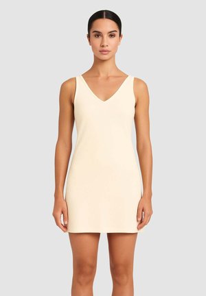 Vestito senza maniche con scollatura a V in tessuto beige chiaro. Il materiale è liscio e leggermente aderente, con un design semplice e minimalista.