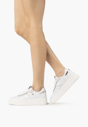 White sneakers with a textured leather upper, gold accents, and a thick white sole. Lace-up design with padded collar and side detailing.